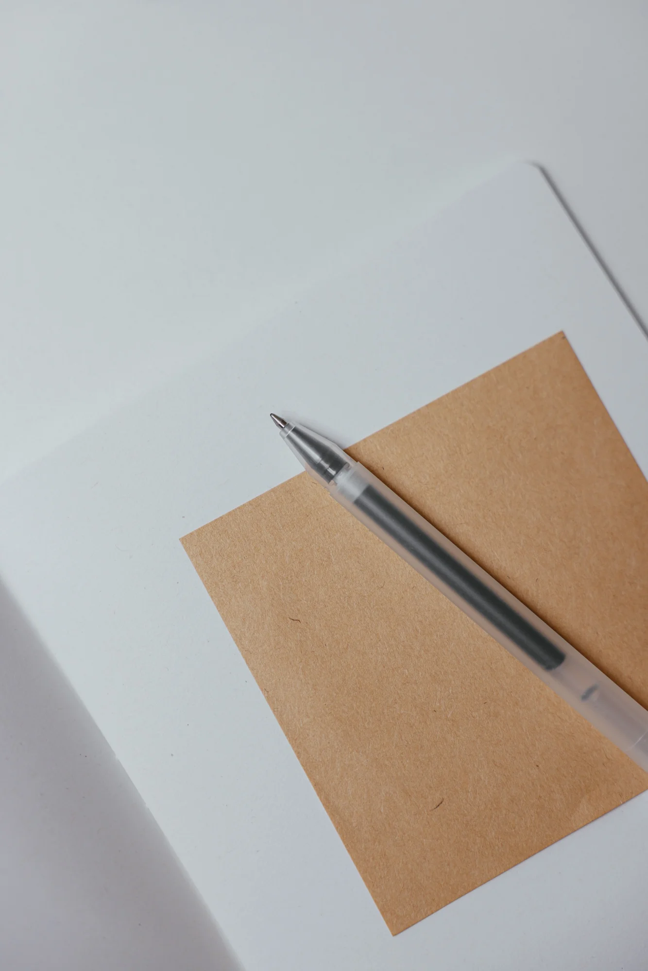 Simple white notebook with neutral pen set
